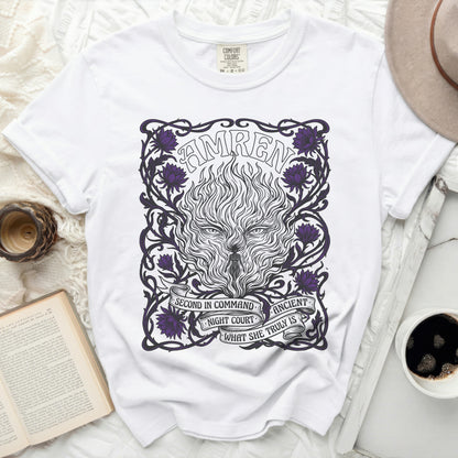 White t-shirt with "AMREN" and fiery wolf design with purple flowers.