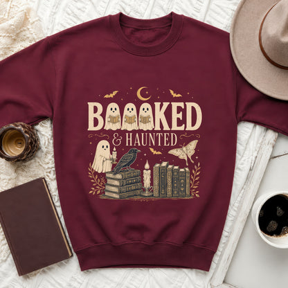 Maroon sweatshirt with the text "BAAAKED & HAUNTED" featuring ghosts and books.