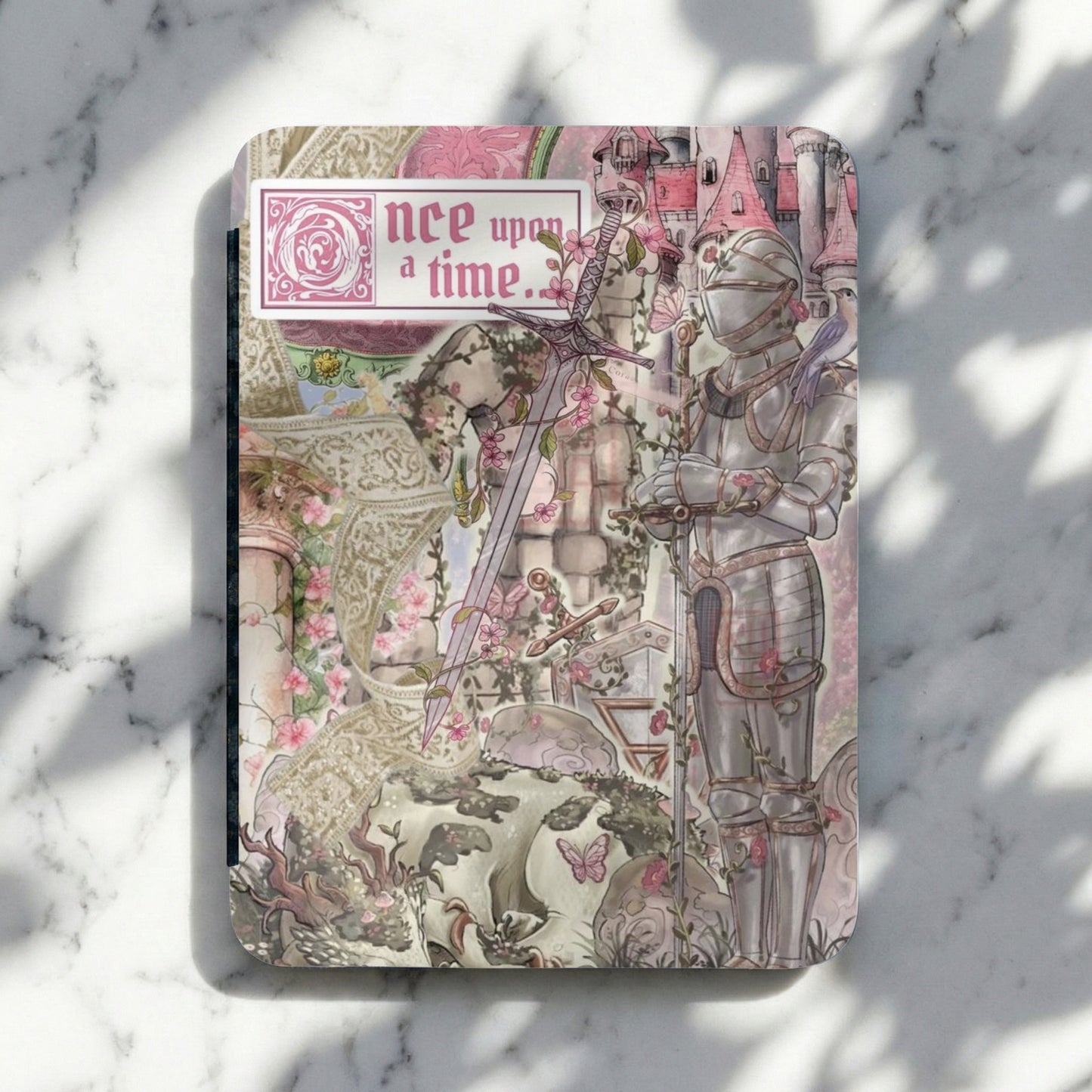Journal with knight, sword, castle, and pink flowers, text "nce upon a time."