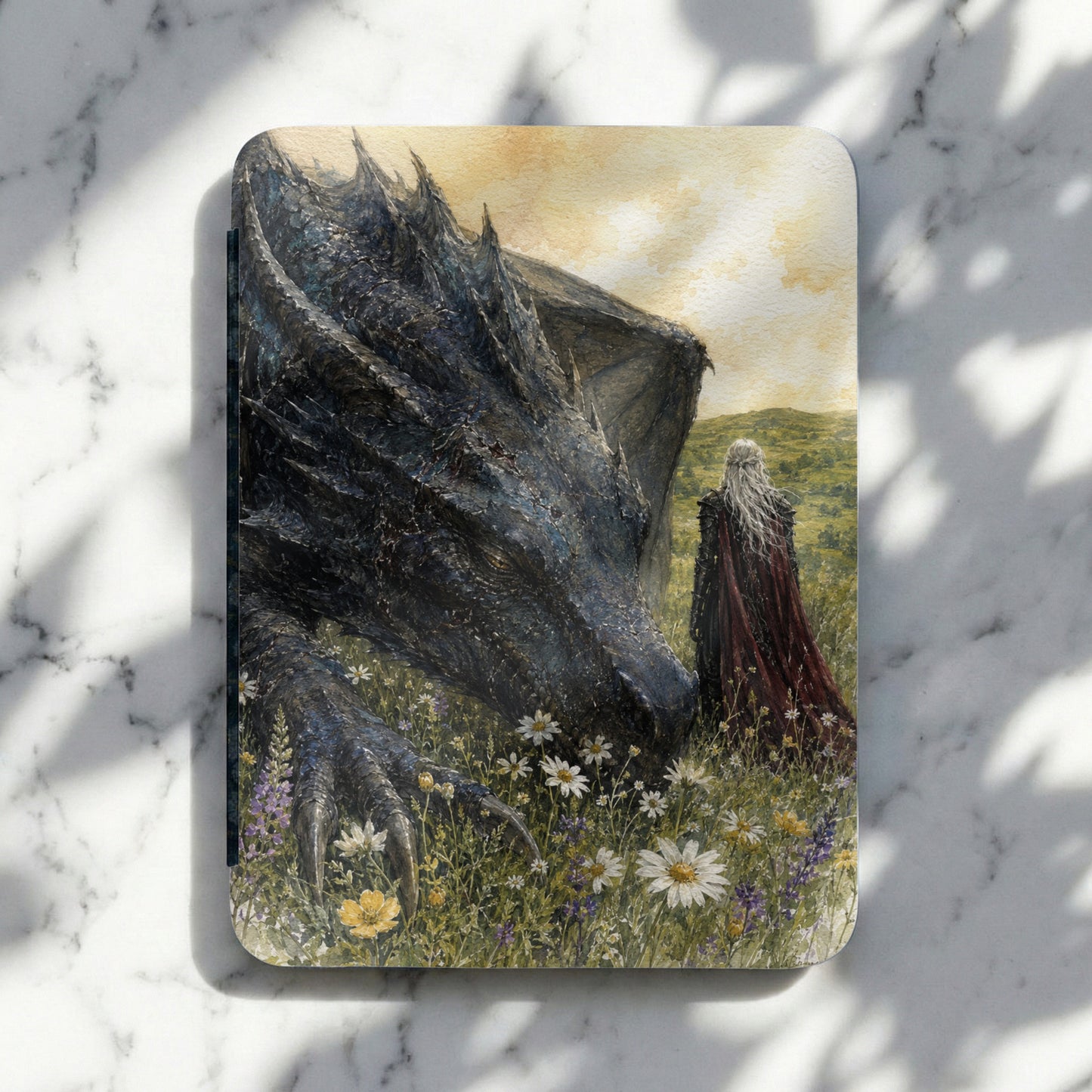 Black dragon and person in red cloak in a field of wildflowers.