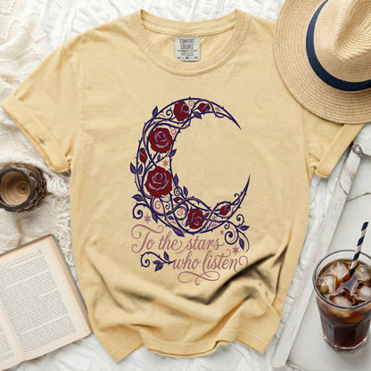 Yellow t-shirt with crescent moon and rose graphic, "To the stars who listen" text.