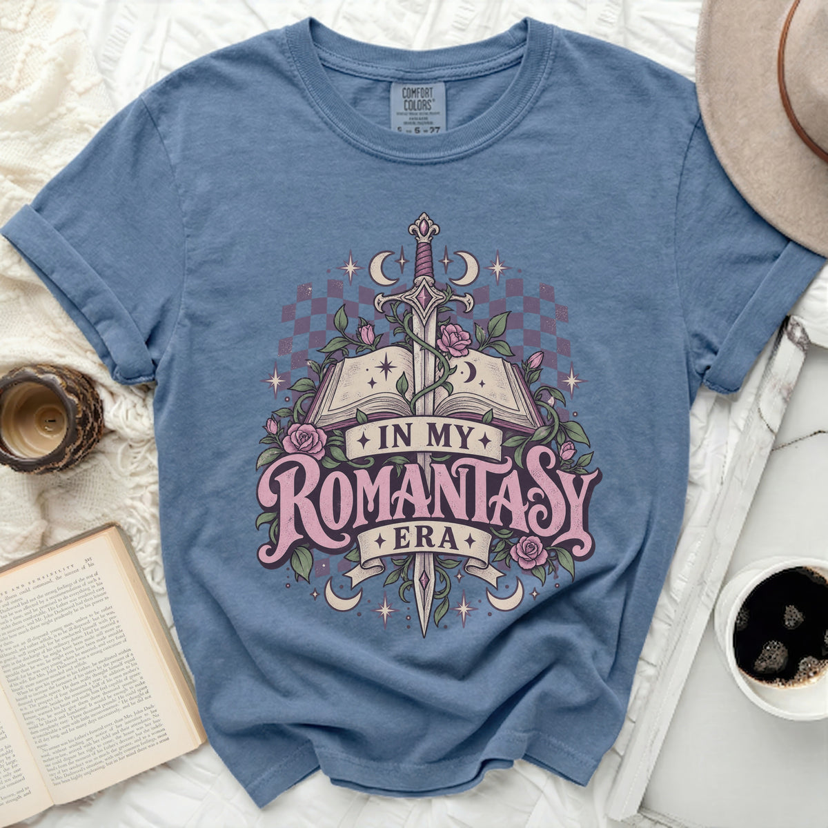 Blue t-shirt with "In My Romantasy Era" sword and roses graphic.