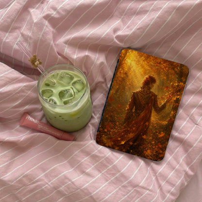 Phone case with autumn forest scene and beverage spill on pink striped fabric.