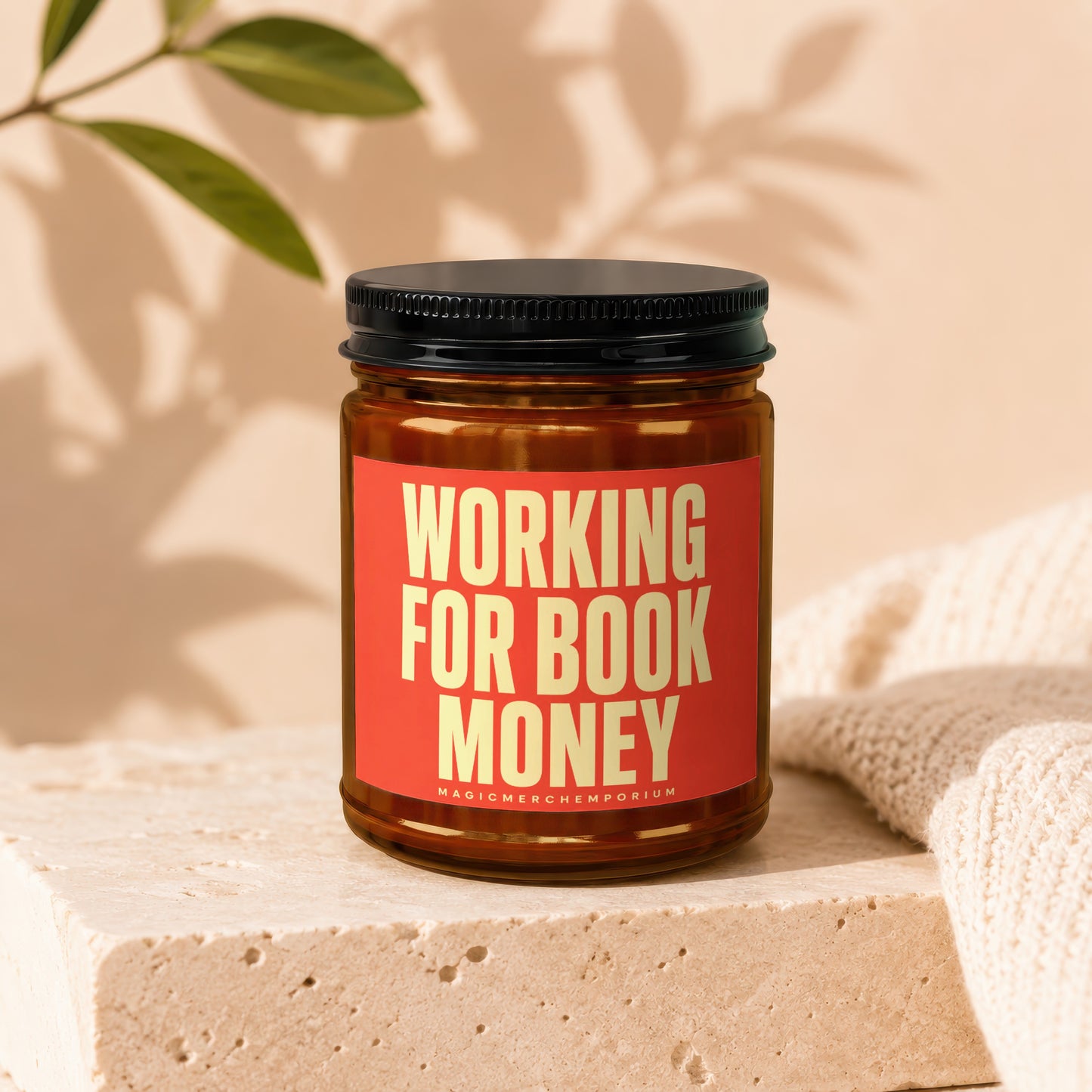 Amber jar with black lid, red label reading "WORKING FOR BOOK MONEY".