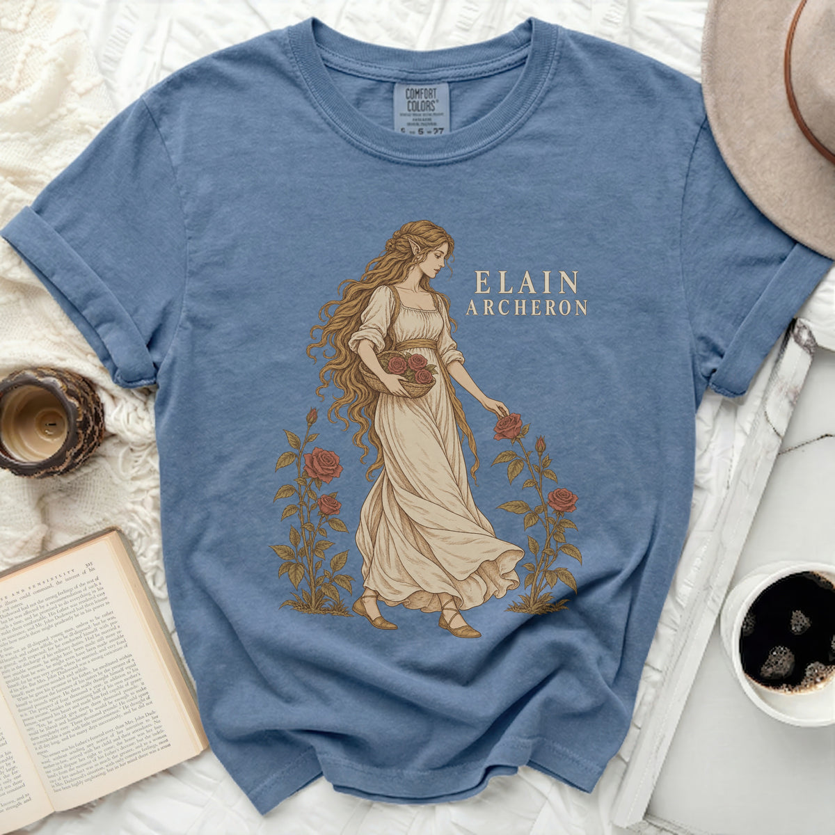 Blue t-shirt with Elain Archeron illustration and roses, Comfort Colors tag.