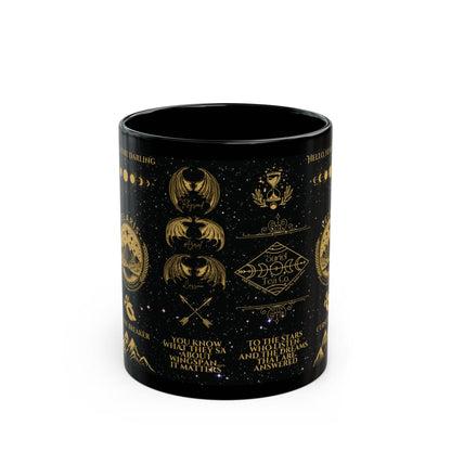 a black mug with gold designs on it