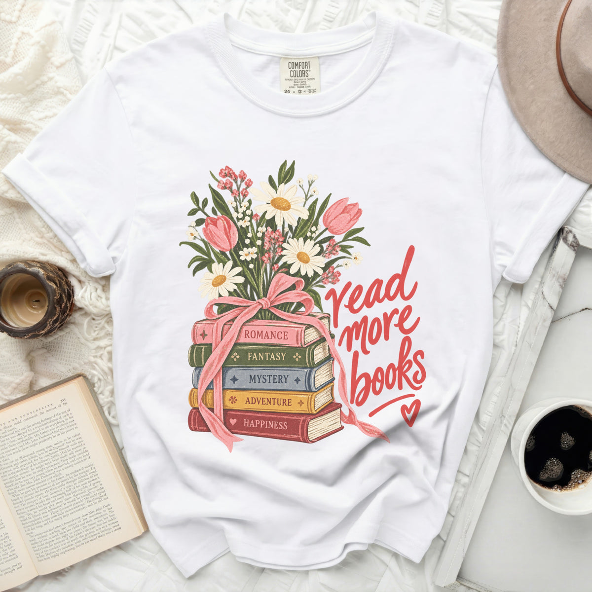 White t-shirt with stack of books, flowers, and "read more books" text.