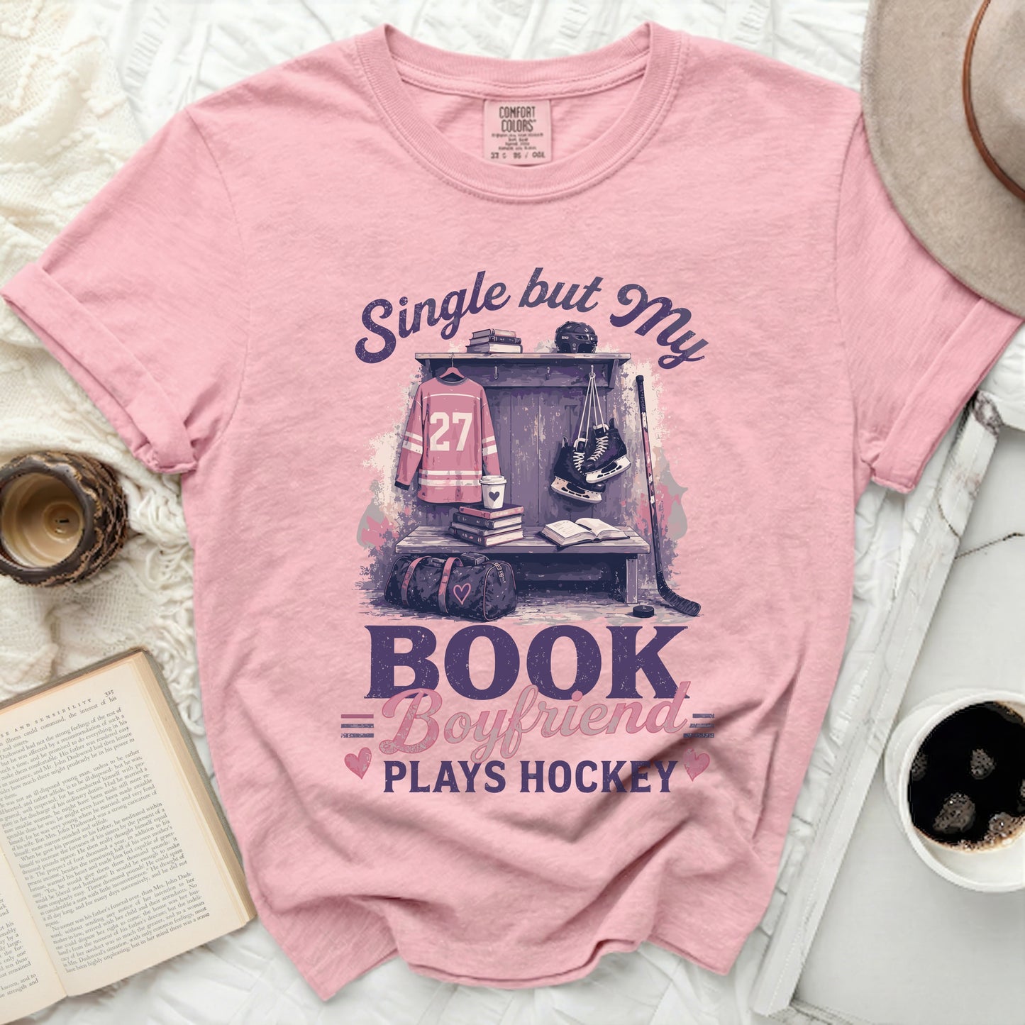 Pink t-shirt with "Single but My Boyfriend Plays Hockey" graphic.