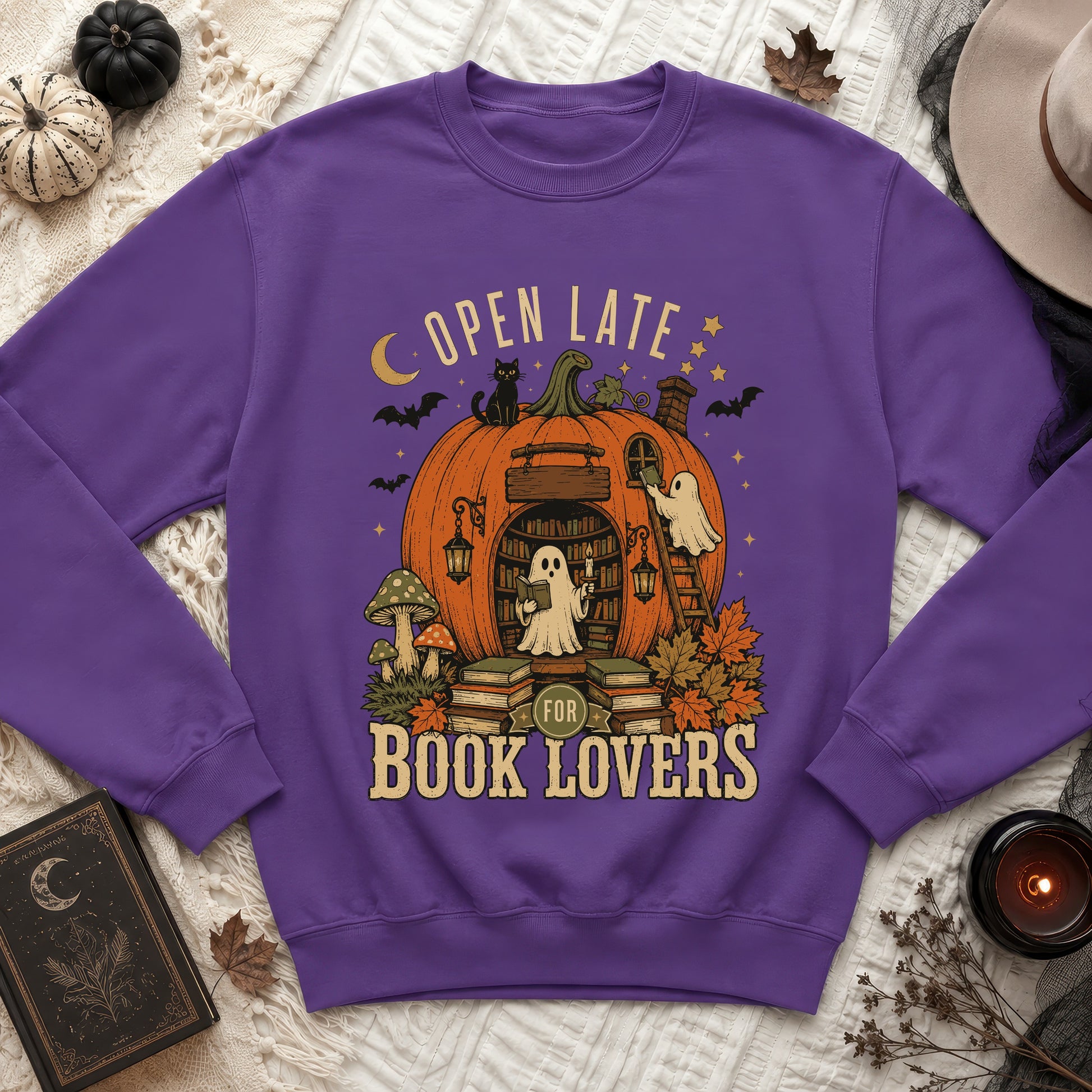 Purple sweatshirt with Halloween pumpkin graphic, "Open Late for Book Lovers" text.
