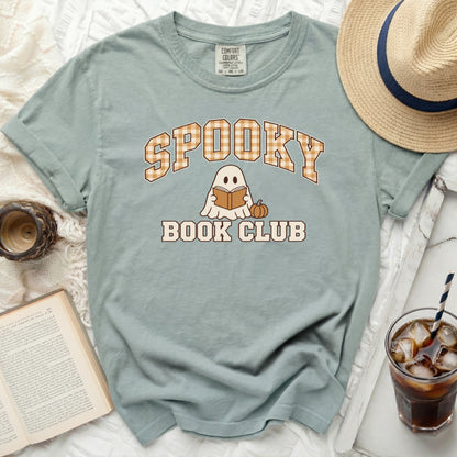 Light blue t-shirt with "Spooky Book Club" graphic featuring a ghost reading a book.
