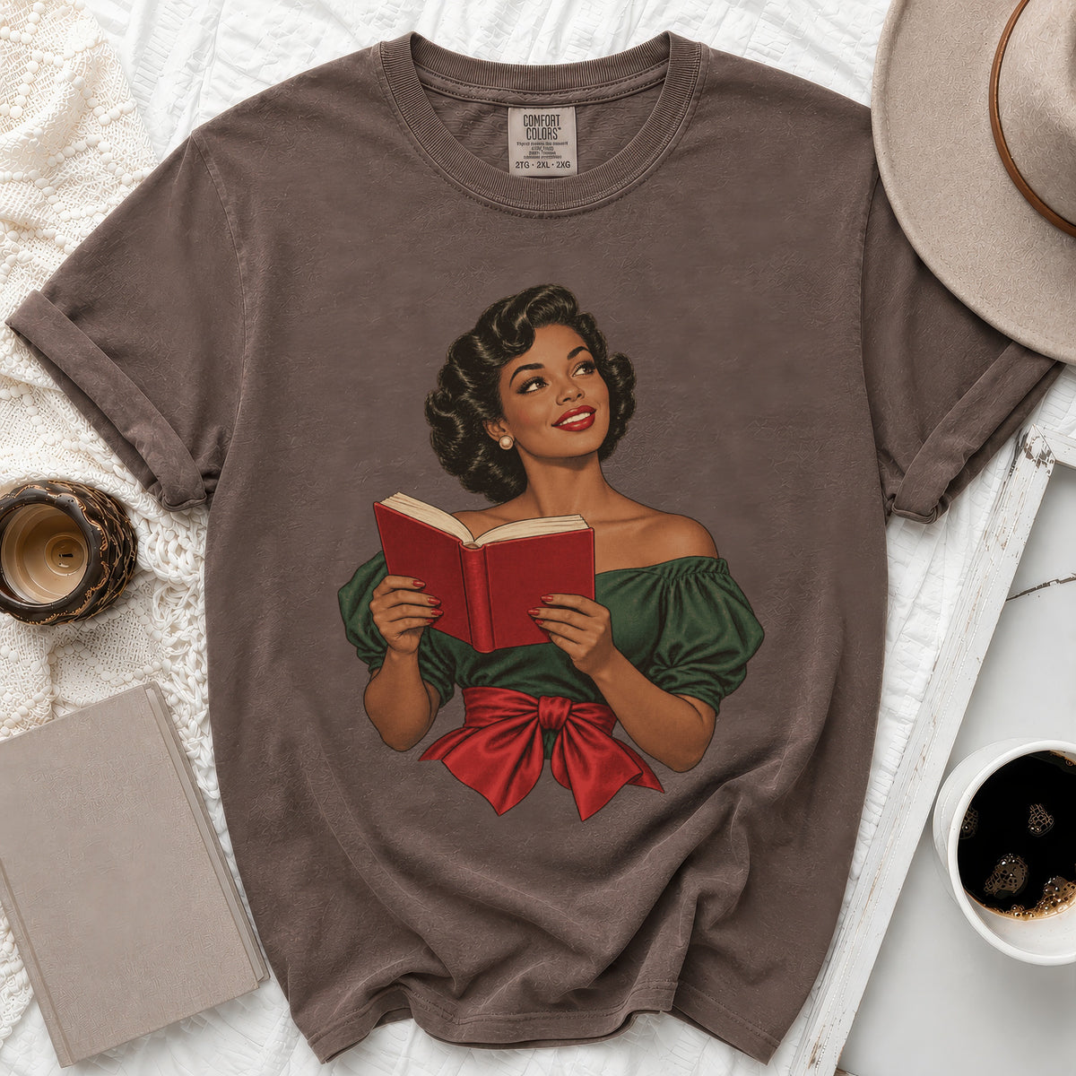 Brown t-shirt with retro illustration of woman reading a book and Comfort Colors size 2XG.