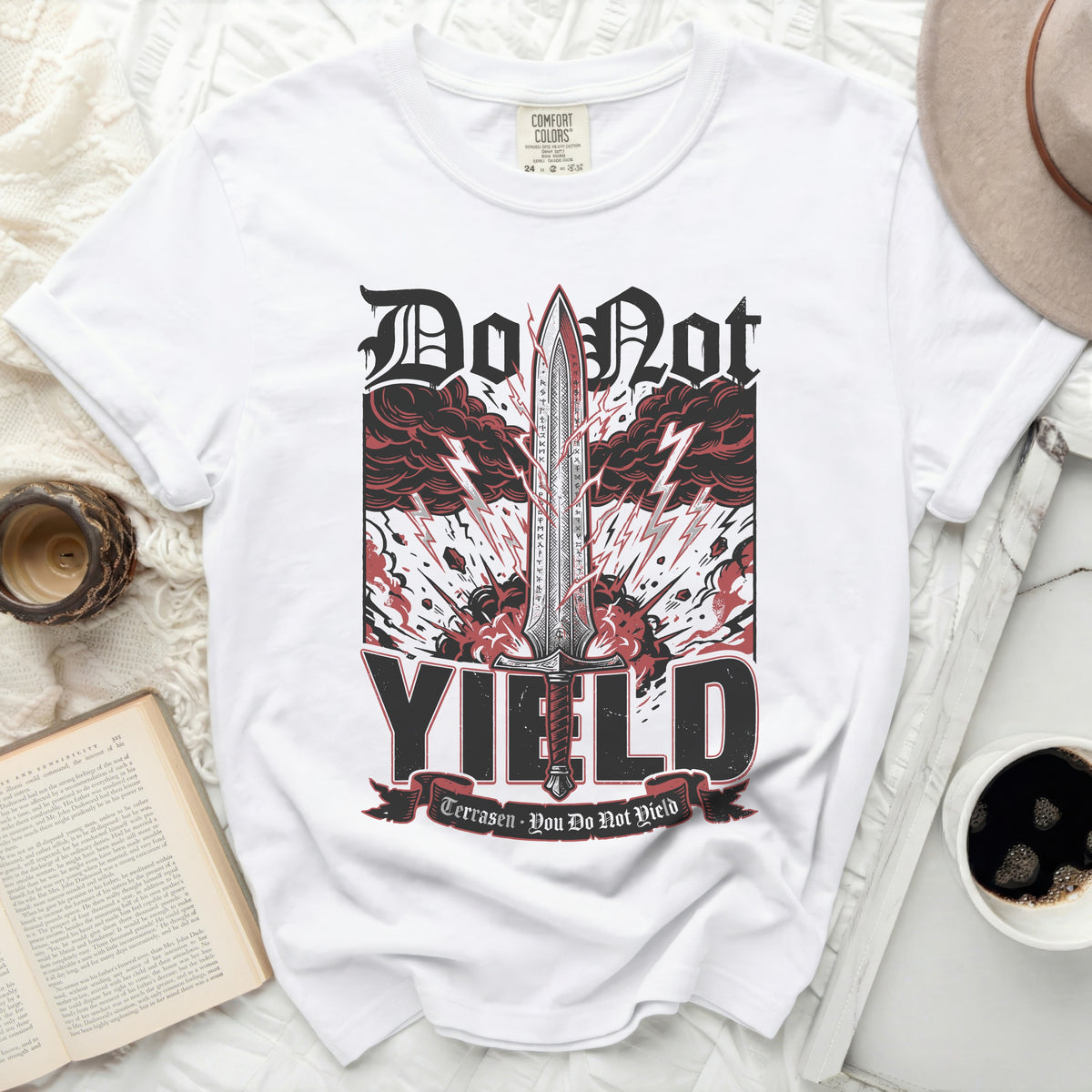 White Comfort Colors t-shirt with "Do Not YIELD" sword graphic.