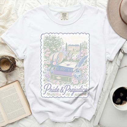 White t-shirt with "Pride & Prejudice" book, quill, and manor graphic.