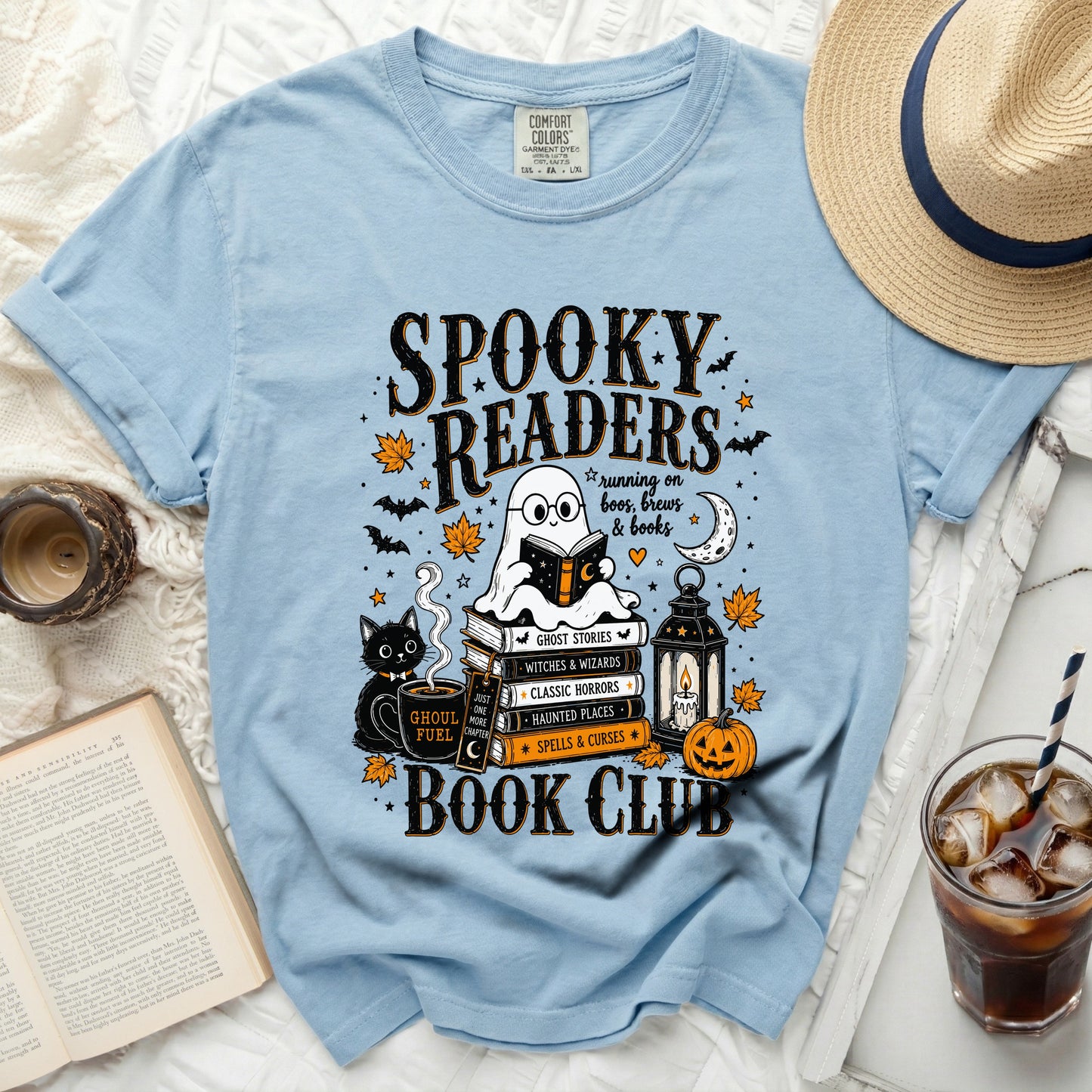 Blue t-shirt with "Spooky Readers" and book club graphics, ghost, cat, and pumpkin.