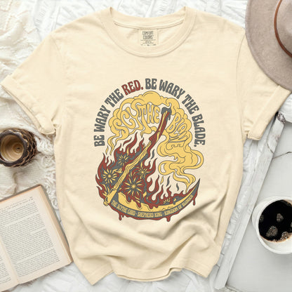 Cream t-shirt with "Be Wary the Red. Be Wary the Blade" text.