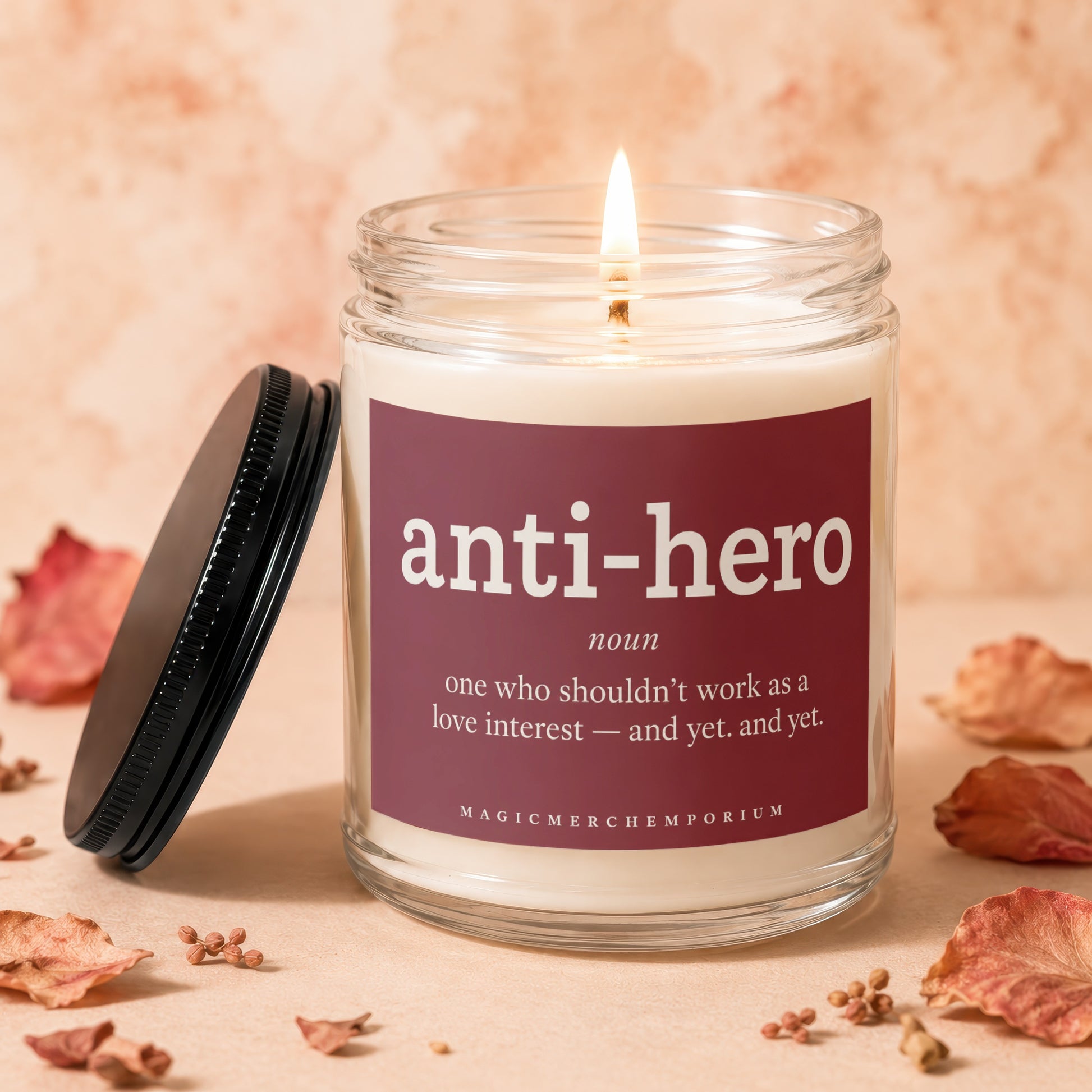 Lit candle with "anti-hero" definition and "Magicmerchemporium" logo.
