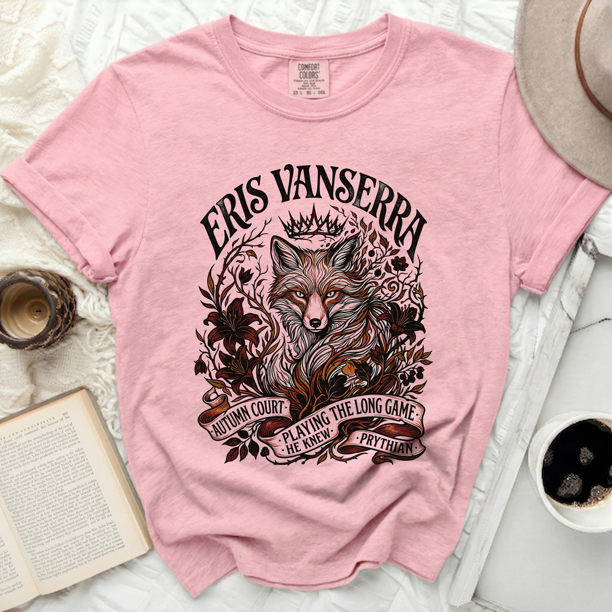 Pink t-shirt with a fox wearing a crown and text "Eris Vanserra Autumn Court Playing the Long Game He Knew Prythian".