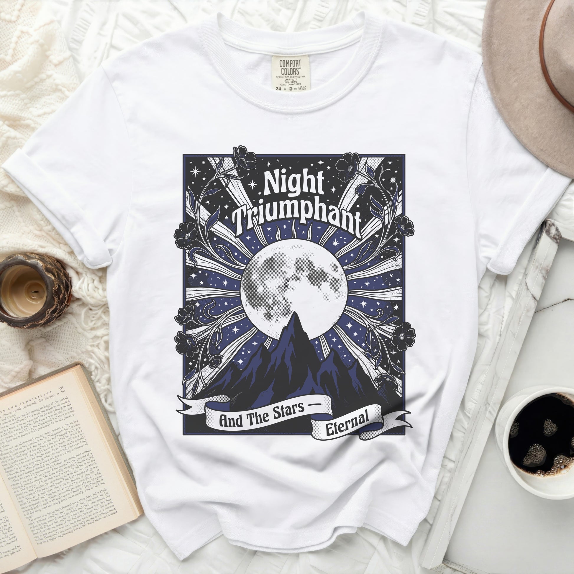White t-shirt with "Night Triumphant And The Stars Eternal" graphic.