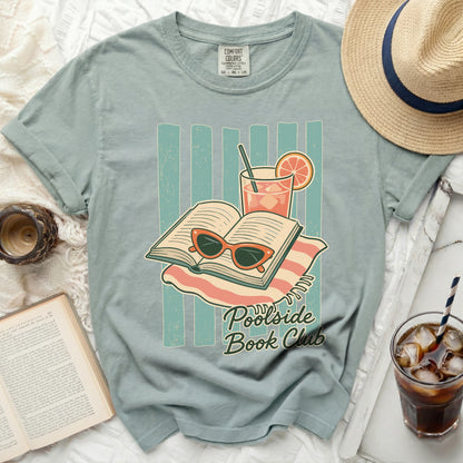 T-shirt graphic with open book, sunglasses, drink, and "Poolside Book Club" text.