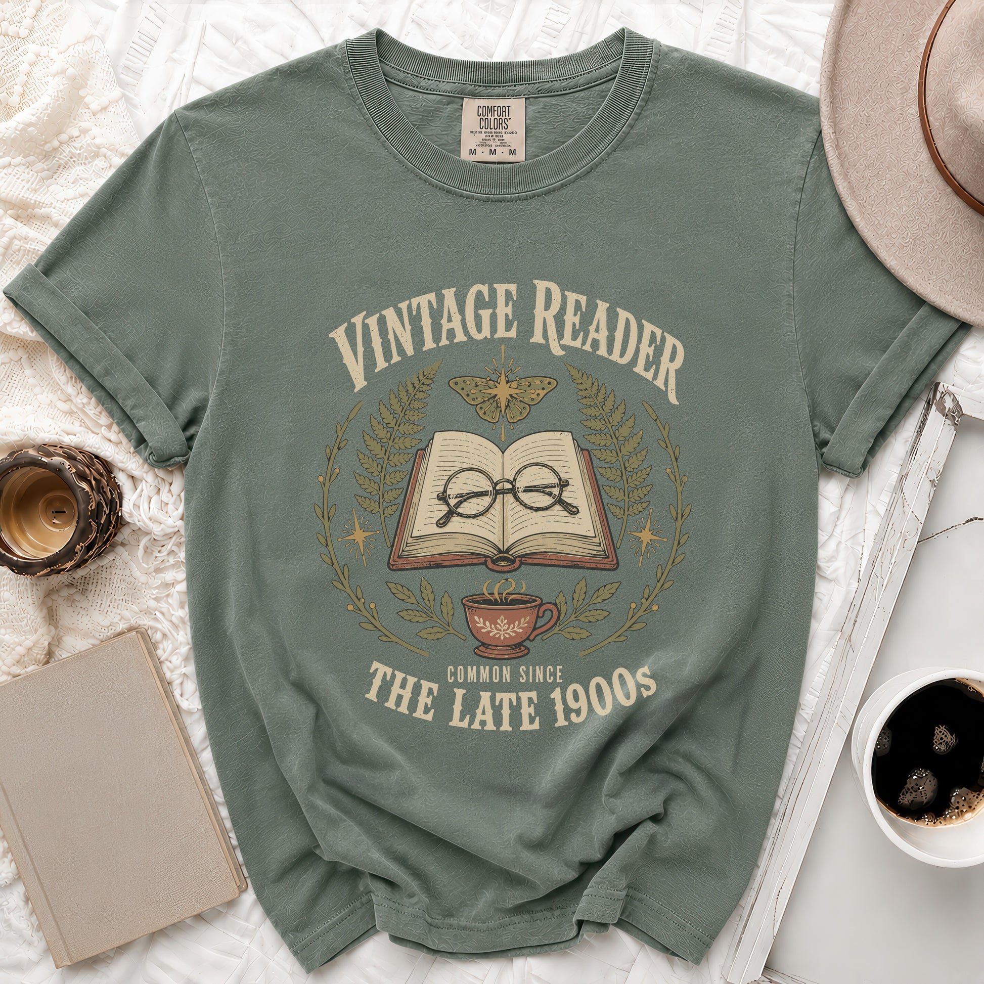 Green t-shirt with "Vintage Reader Common Since The Late 1900s" graphic.
