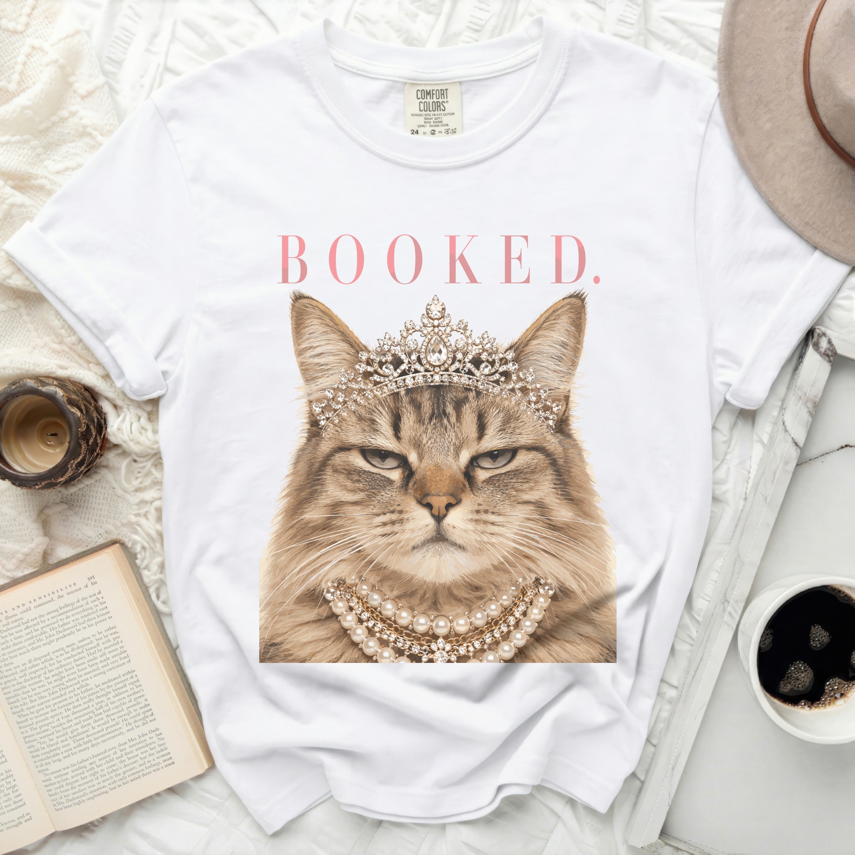 T-shirt with a regal cat wearing a tiara and pearls, text 