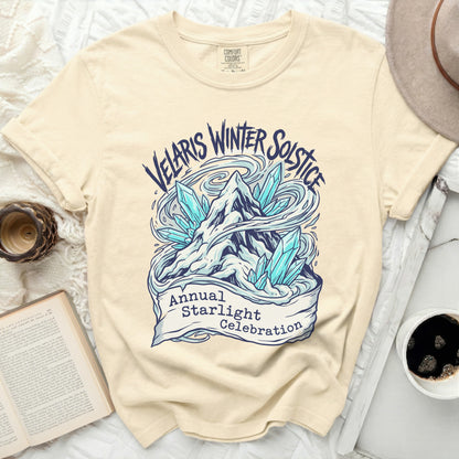 Cream t-shirt with "Velaris Winter Solstice Annual Starlight Celebration" graphic.