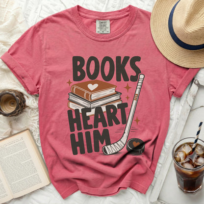 Pink t-shirt with "BOOKS HEART HIM" and book, hockey stick graphics.