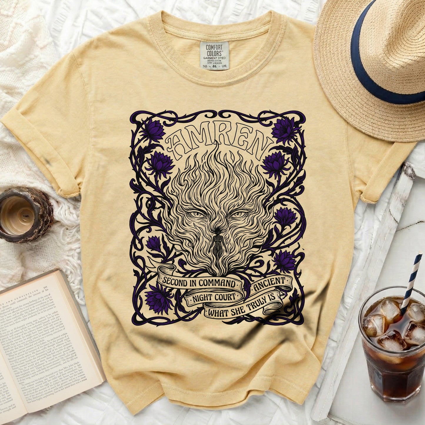 Yellow t-shirt with "AMREN" and a fiery wolf design with purple flowers.