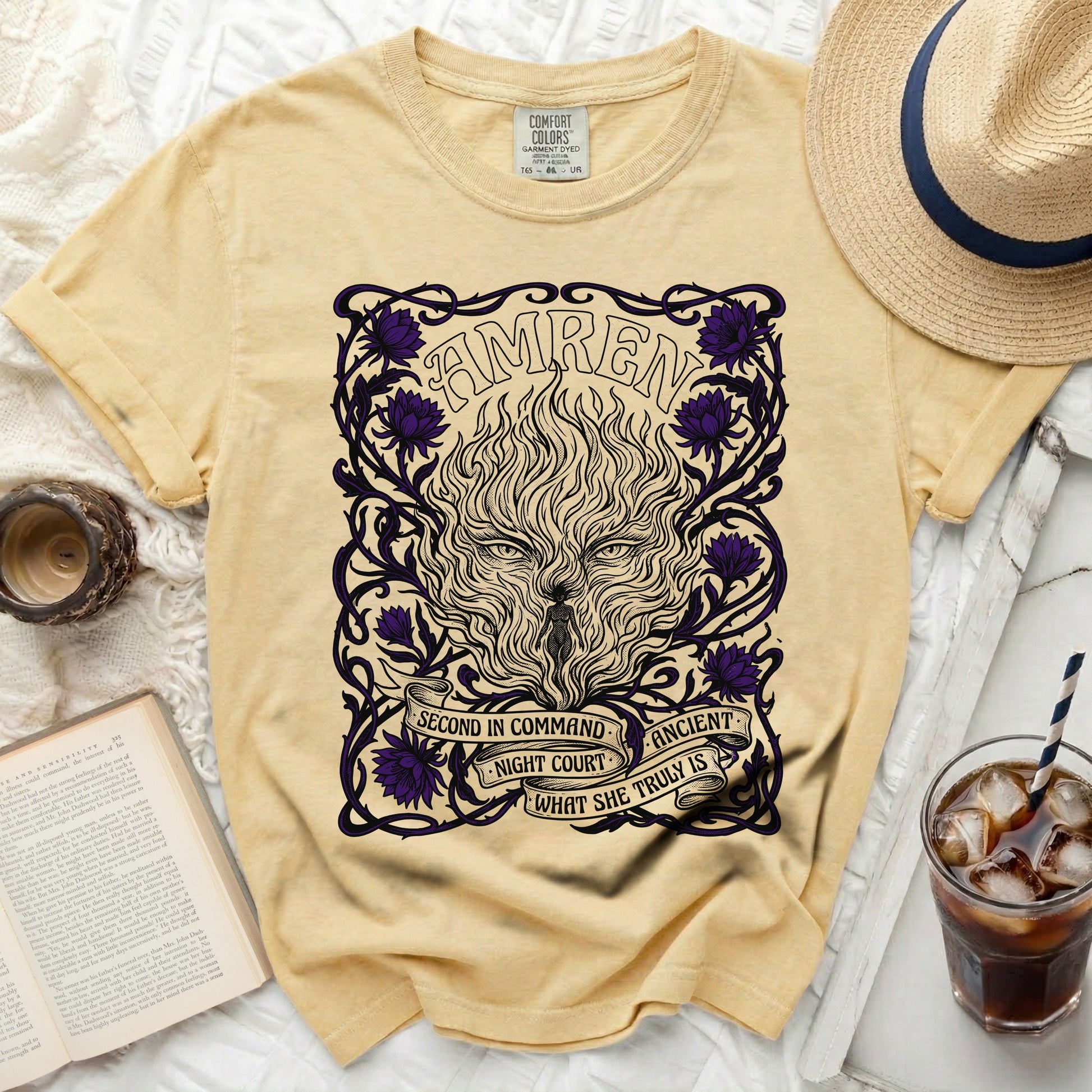 Yellow t-shirt with "AMREN" and a fiery wolf design with purple flowers.