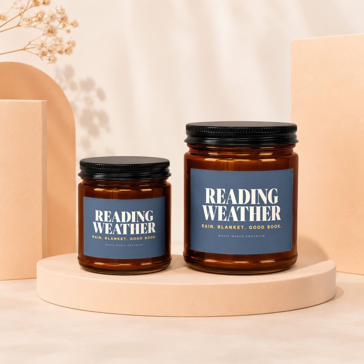 Two amber glass candles with blue labels reading "Reading Weather".