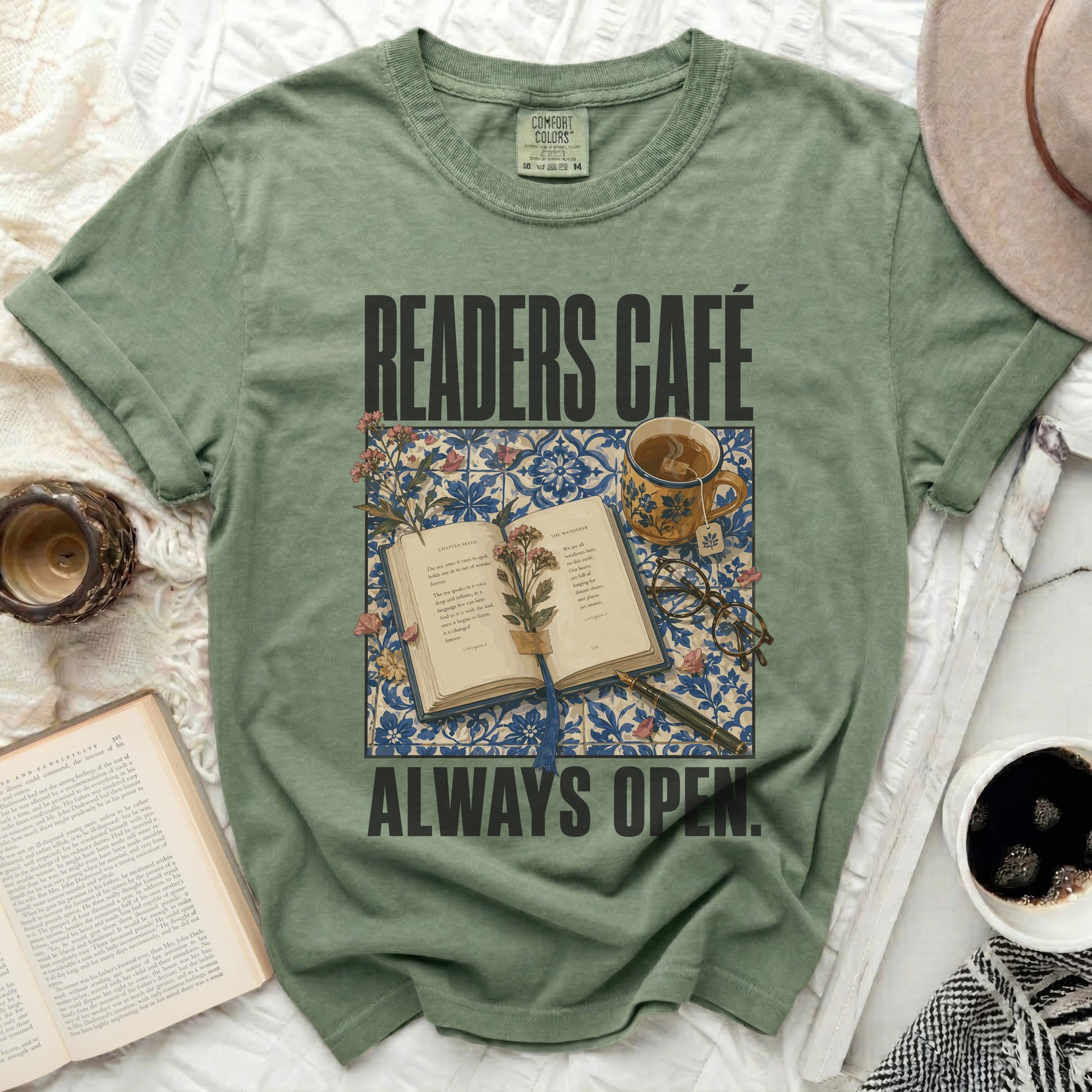 Green t-shirt with "READERS CAFÉ ALWAYS OPEN" and open book graphic.