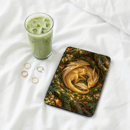 Tablet case with a sleeping golden dragon on a mossy forest floor.