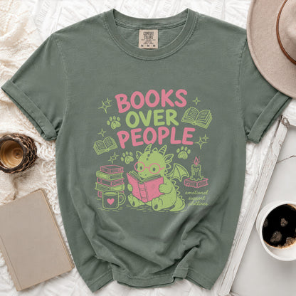 Green t-shirt with "Books Over People" text featuring a dragon reading.