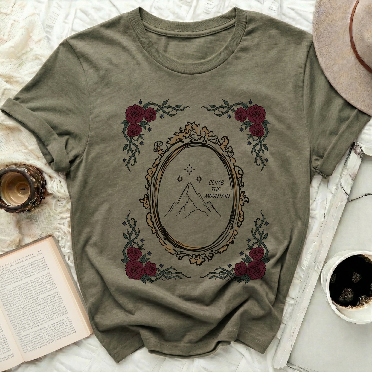 Olive Green Climb The Mountain Design Rose Vine Framed Stars product type
Graphic T-shirt, Mountain Design, Rose Floral Tee, Nature Inspired, Adventure Shirt, Inspirational Tee, Climb The Mountain, Stars Motif, Framed Artwork, Olive Green Top, Army Green Shirt, Wilderness Theme, Outdoor Enthusiast, Unisex Apparel, Casual Wear, Everyday Style, Unique Design, Artistic Shirt, Bohemian Vibes, Vintage Aesthetic