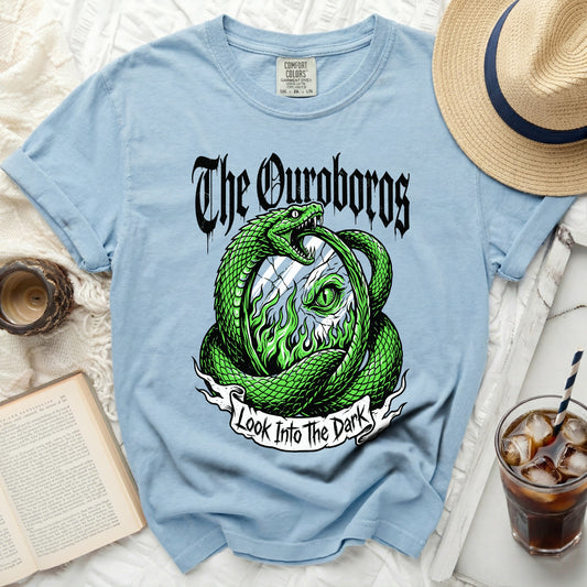 Light blue t-shirt with "The Ouroboros" and a snake graphic saying "Look Into The Dark".