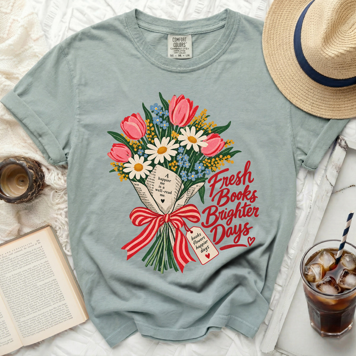 T-shirt with a bouquet of flowers made of books, with text "Fresh Books Brighter Days".