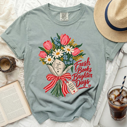 T-shirt with a bouquet of flowers made of books, with text "Fresh Books Brighter Days".