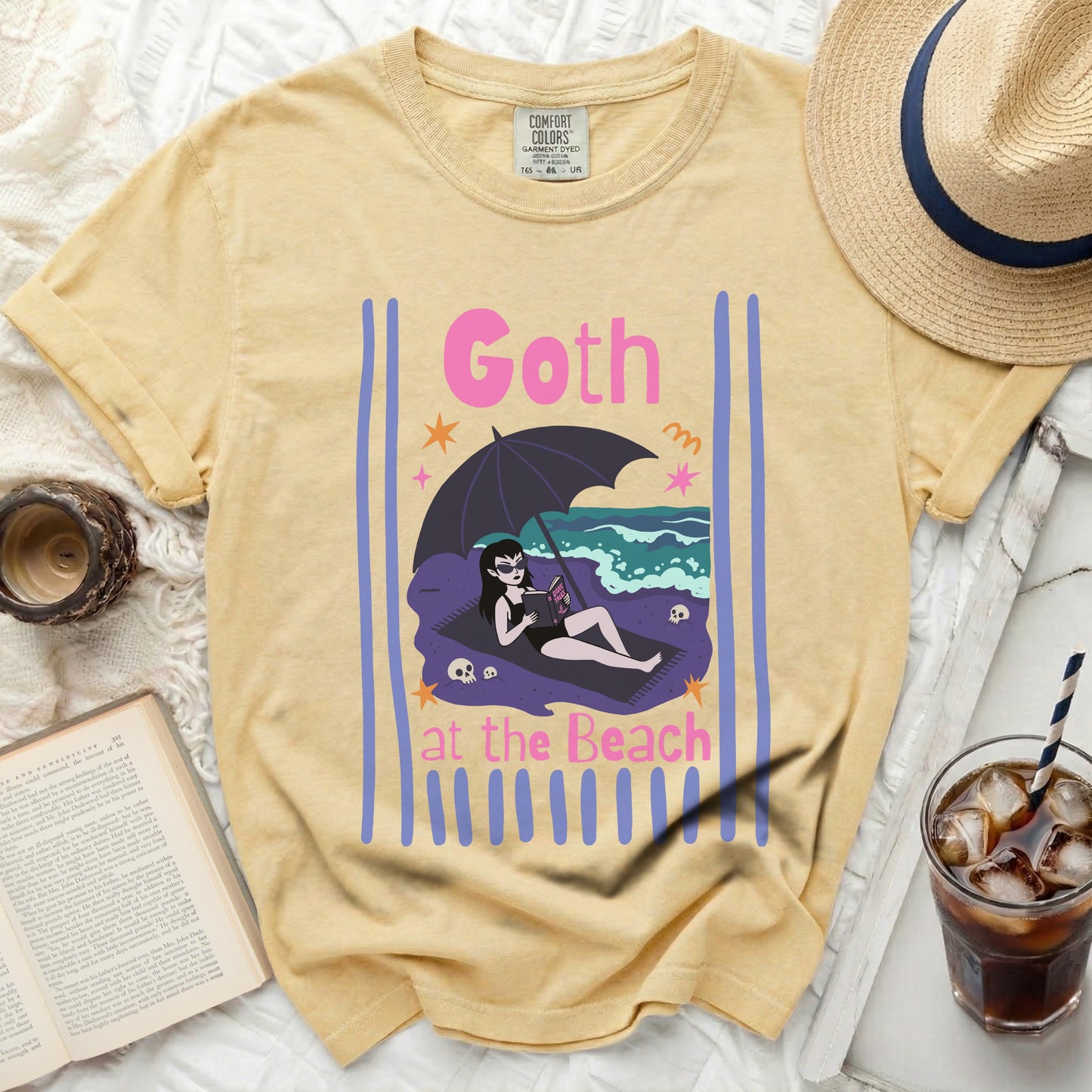 Yellow t-shirt with "Goth at the Beach" graphic.