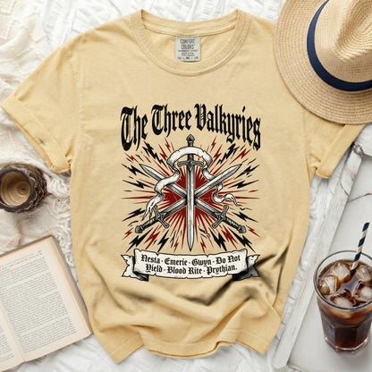 Yellow t-shirt with "The Three Valkyries" and names on the front.