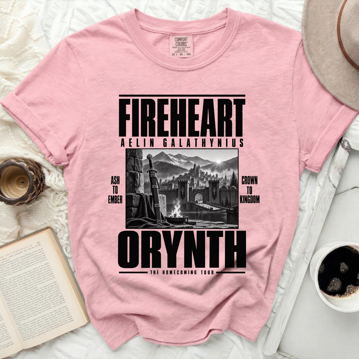 Pink t-shirt with "Fireheart Aelin Galathynius Orynth The Homecoming Tour" text and castle graphic.