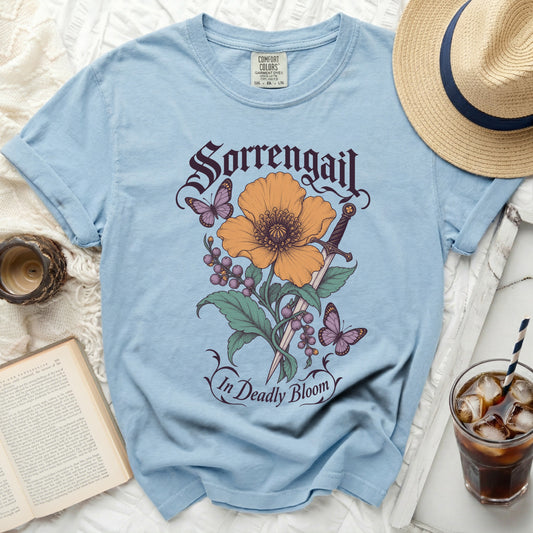 Light blue t-shirt with Sorrengail and In Deadly Bloom text and floral design.