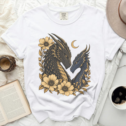 White Comfort Colors t-shirt featuring a dark and light blue dragon design with yellow flowers.