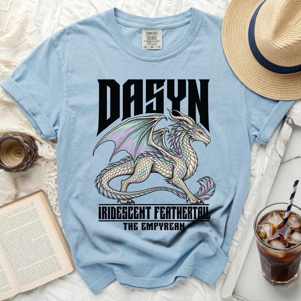 Light blue t-shirt with a white dragon graphic and text "DASYN" and "IRIDESCENT FEATHERTAIL THE EMPYREAN".