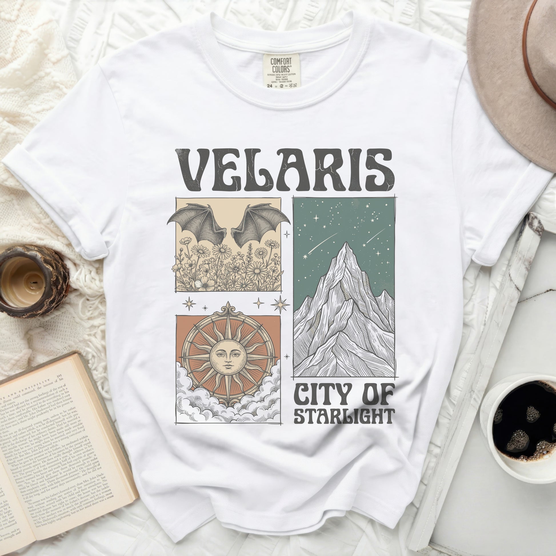 Velaris City of Starlight graphic tee with bat, sun, and mountain illustrations.