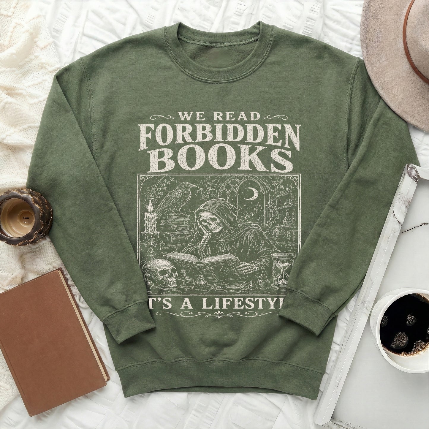 Green sweatshirt with "WE READ FORBIDDEN BOOKS ITS A LIFESTYLE" text.