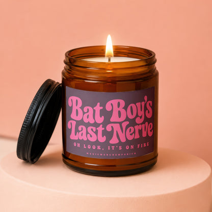 Amber jar candle lit, with label reading "Bat Boy's Last Nerve".