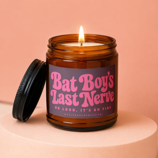 Amber jar candle lit, with label reading "Bat Boy's Last Nerve".