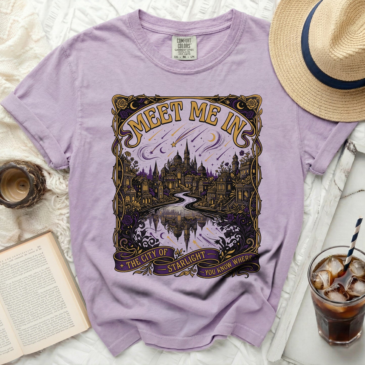 Purple t-shirt with "Meet Me In The City Of Starlight" graphic.