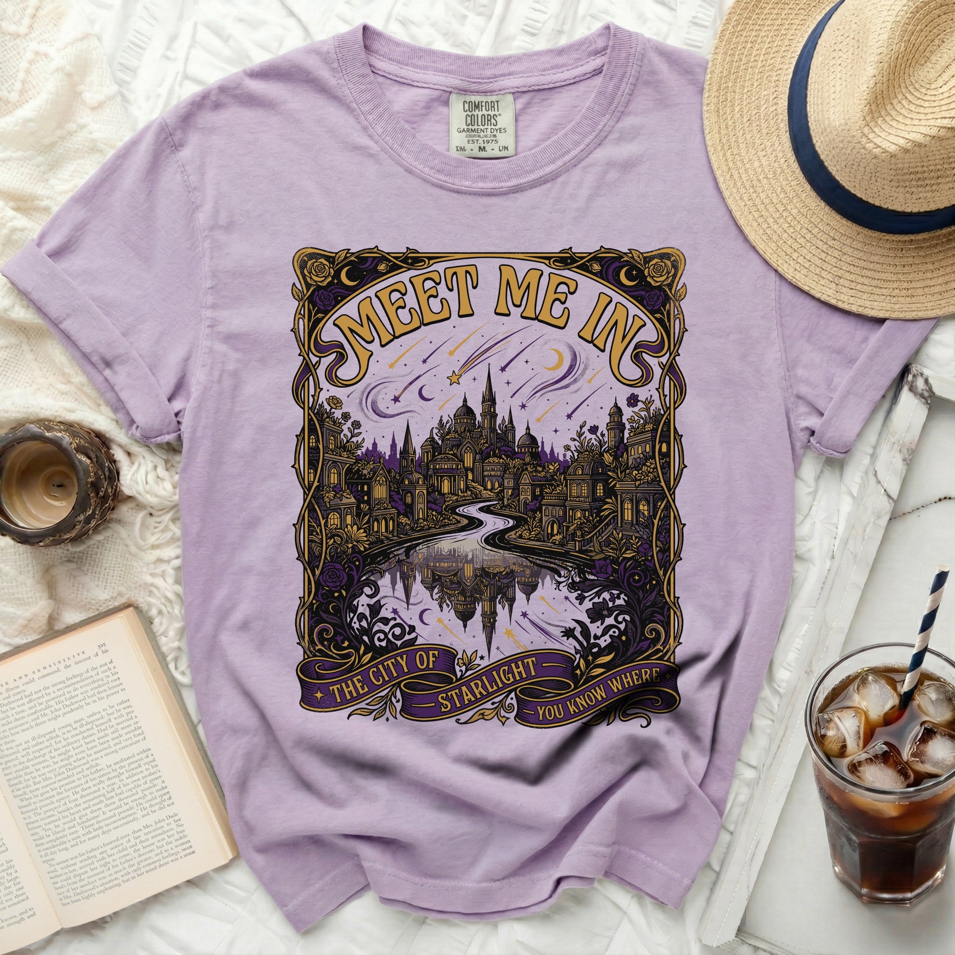Purple t-shirt with "Meet Me In The City Of Starlight" graphic.