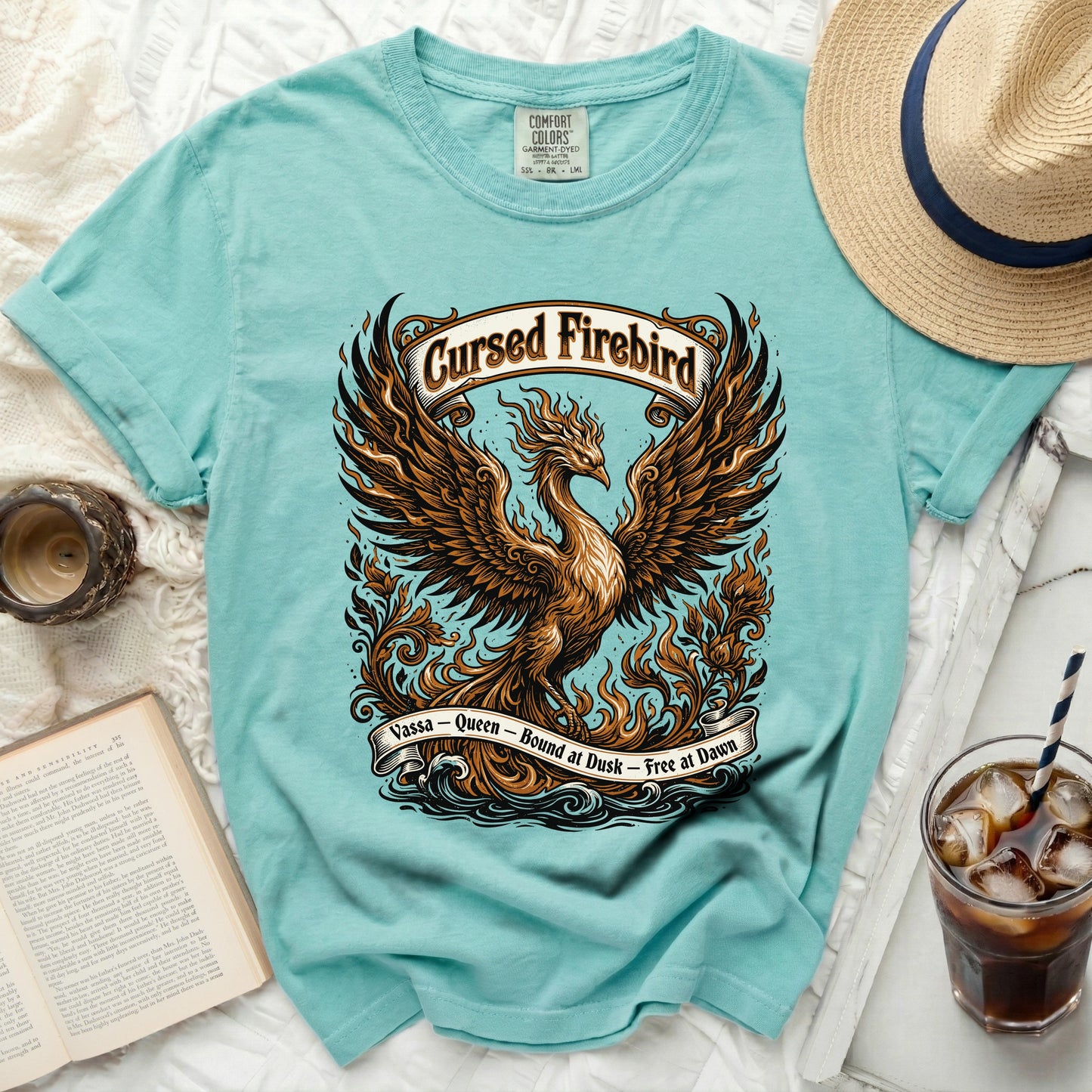 Teal Comfort Colors t-shirt with a phoenix graphic and text "Cursed Firebird Vassa - Queen - Bound at Dusk - Free at Dawn".
